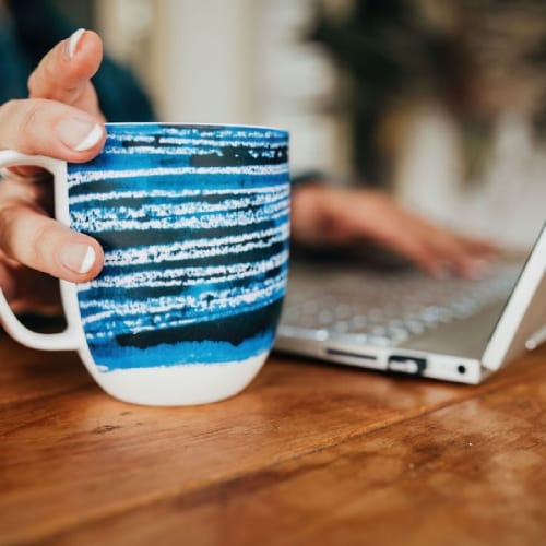 A professional business owner managing invoicing and expense tracking on a laptop, supported by expert bookkeeping and BAS Lodgement Sydney.